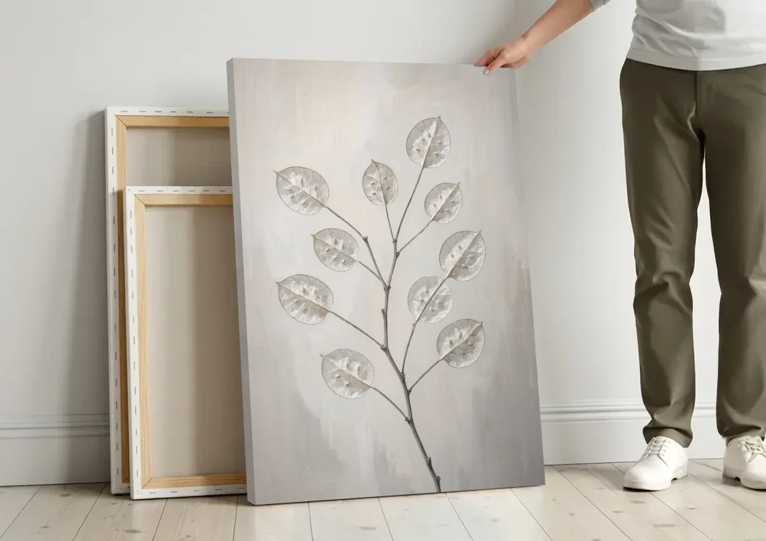 Minimalist Botanical Wall Art with Honesty Seed Pods canvas wall art leaning against a wall next to blank canvases
