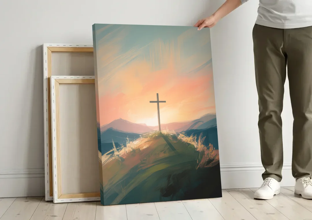 Minimalist Christian Cross on Hill canvas wall art leaning against a wall next to blank canvases