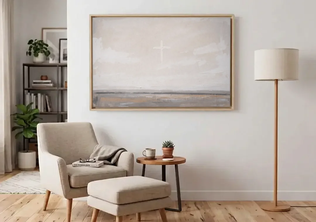 Minimalist Christian Wall Art with a Misty Cross canvas wall art above an armchair in a bright living room