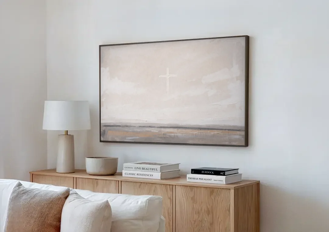 Minimalist Christian Wall Art with a Misty Cross canvas wall art above a wooden sideboard next to a sofa