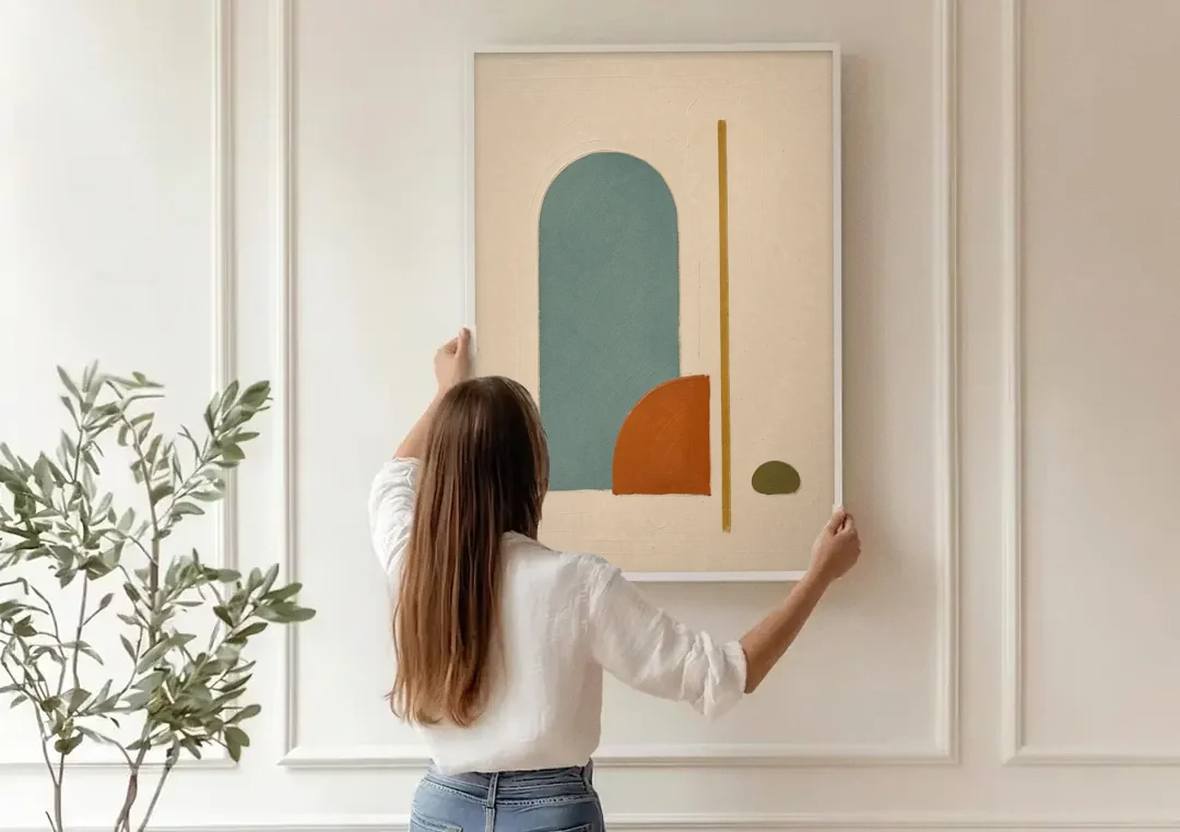 Minimalist Geometric Teal Arch with Terracotta Half-Circle canvas wall art being hung on a paneled wall