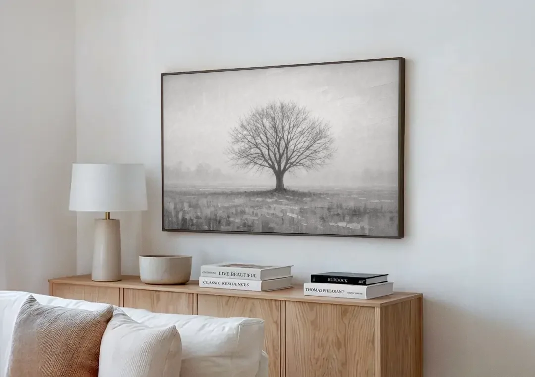 Minimalist Landscape Painting of a Lone Tree in Fog canvas wall art above a wooden sideboard next to a sofa