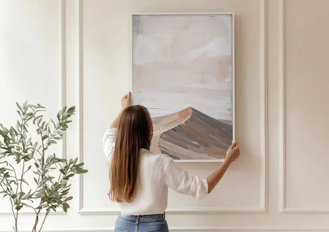 Minimalist Landscape Wall Art of a Sand Dune Ridge canvas wall art being hung on a paneled wall