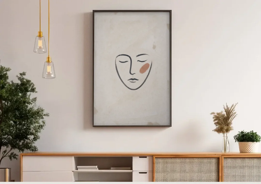 Minimalist Line Art Face with Terracotta Blush canvas wall art above a wooden sideboard under pendant lights