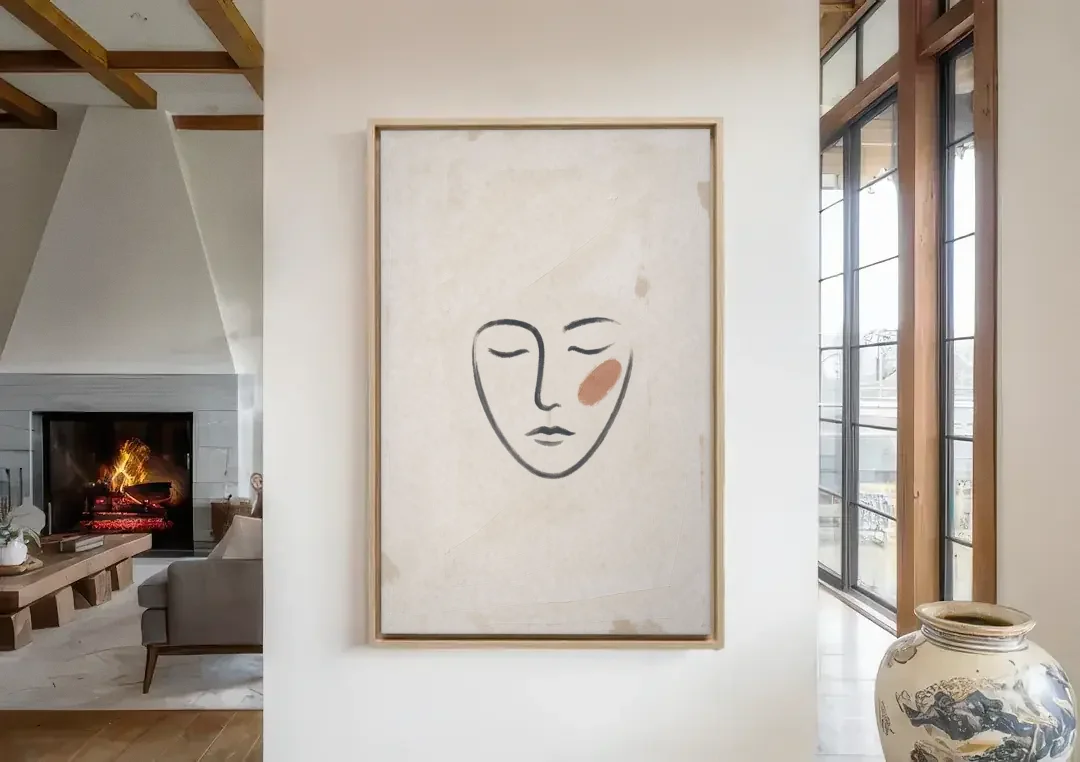 Minimalist Line Art Face with Terracotta Blush canvas wall art in a living room with a fireplace