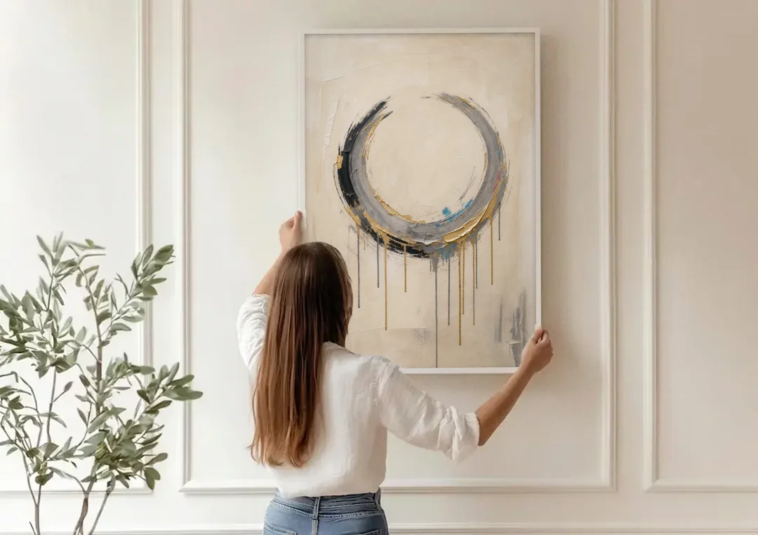 Minimalist Textured Gilded Enso Circle canvas wall art being hung on a paneled wall