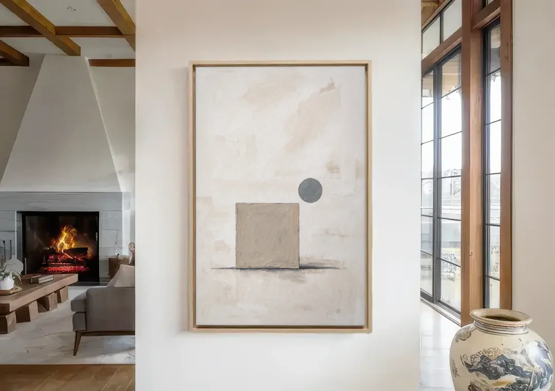 Minimalist Wall Decor with Driftwood Square and Slate Circle canvas wall art in a living room with a fireplace