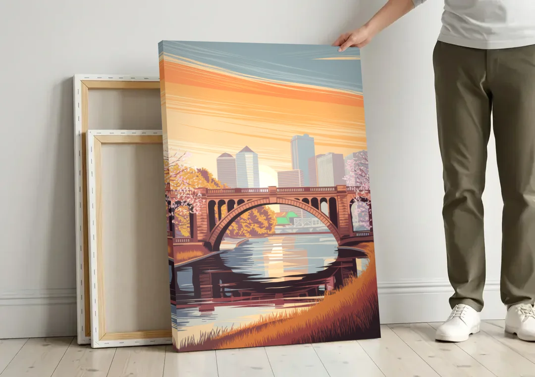 Minneapolis Iconic Stone Arch Bridge canvas wall art leaning against a wall next to blank canvases