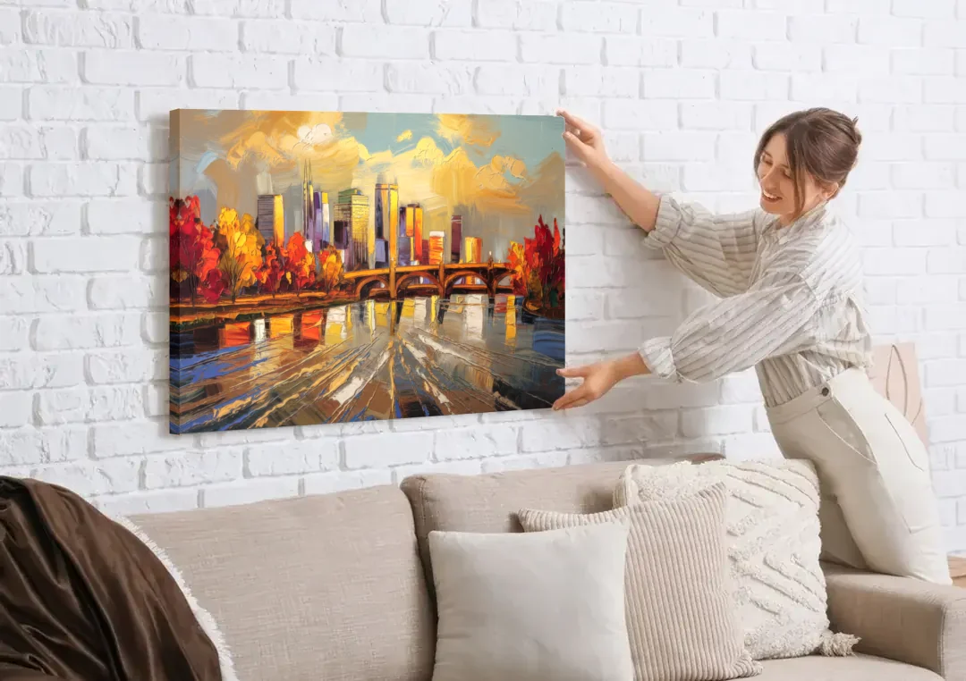Minneapolis Mississippi River View canvas wall art being hung on a white brick wall above a sofa