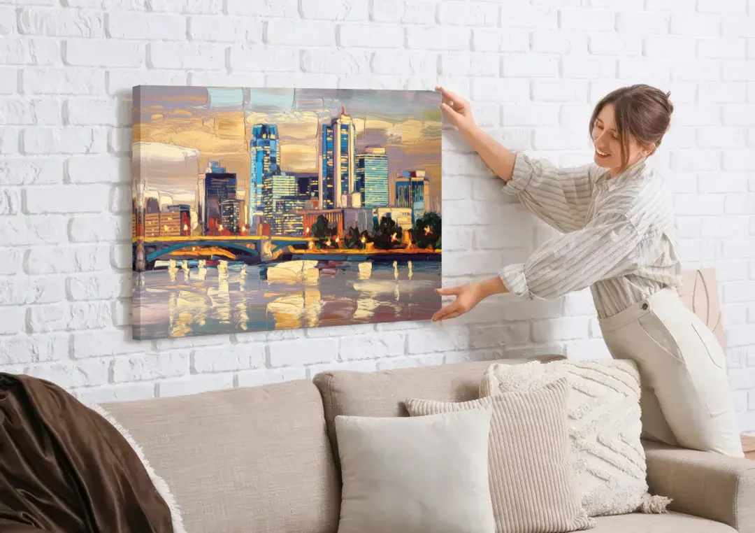 Minneapolis Modern Architectural Beauty canvas wall art being hung on a white brick wall above a sofa