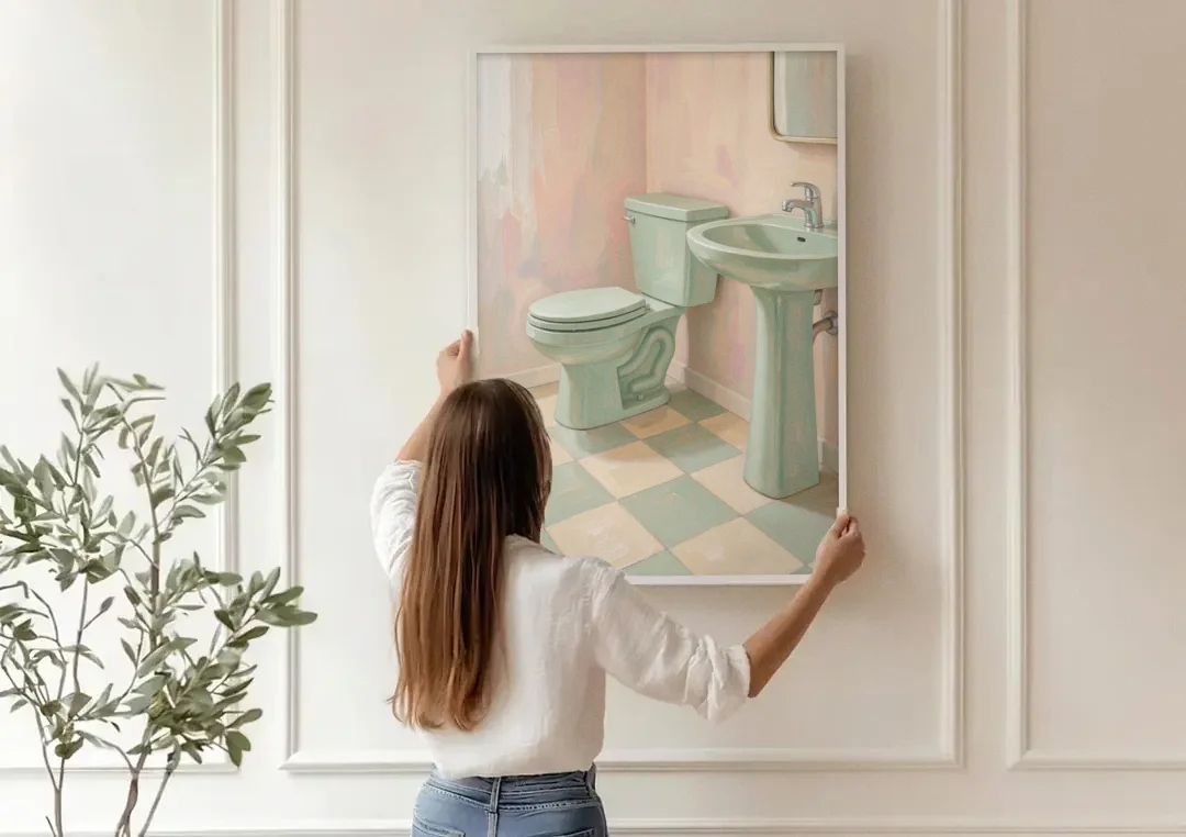 Mint Green Bathroom Decor with Checkerboard Tile canvas wall art being hung on a paneled wall