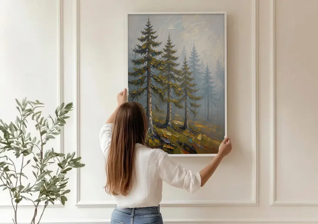 Misty Forest Painting of Pines on a Mossy Slope canvas wall art being hung on a paneled wall
