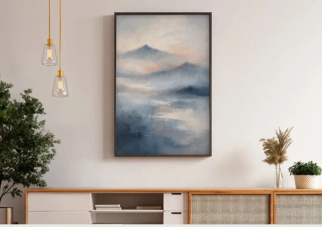 Misty Mountain Painting of Fading Summits canvas wall art above a wooden sideboard under pendant lights