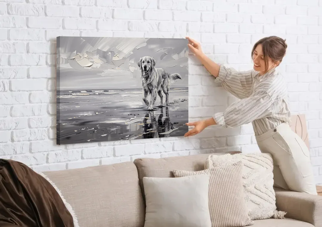 Misty Shore Golden Retriever in Black and White canvas wall art being hung on a white brick wall above a sofa