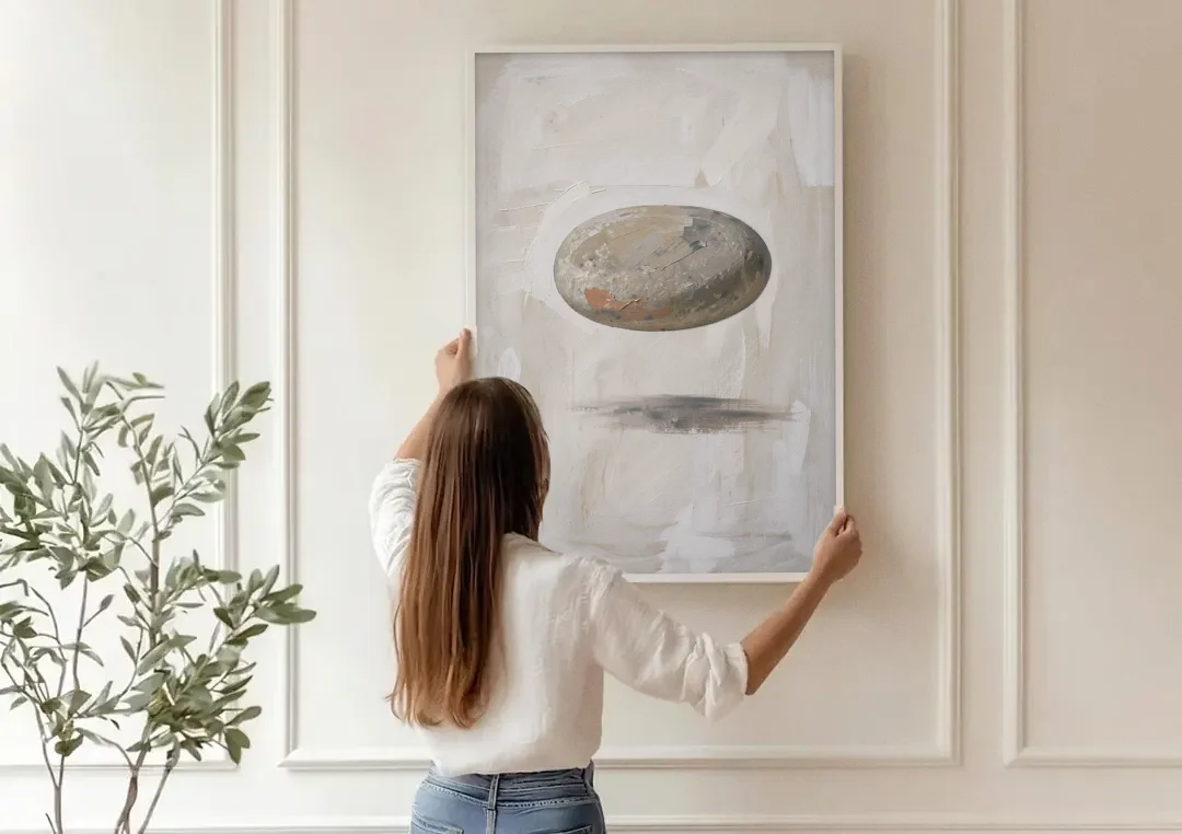 Modern Abstract Canvas Prints with Floating River Stone canvas wall art being hung on a paneled wall