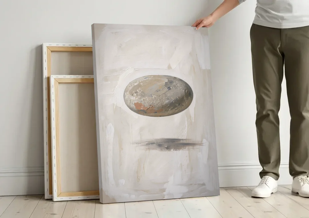 Modern Abstract Canvas Prints with Floating River Stone canvas wall art leaning against a wall next to blank canvases