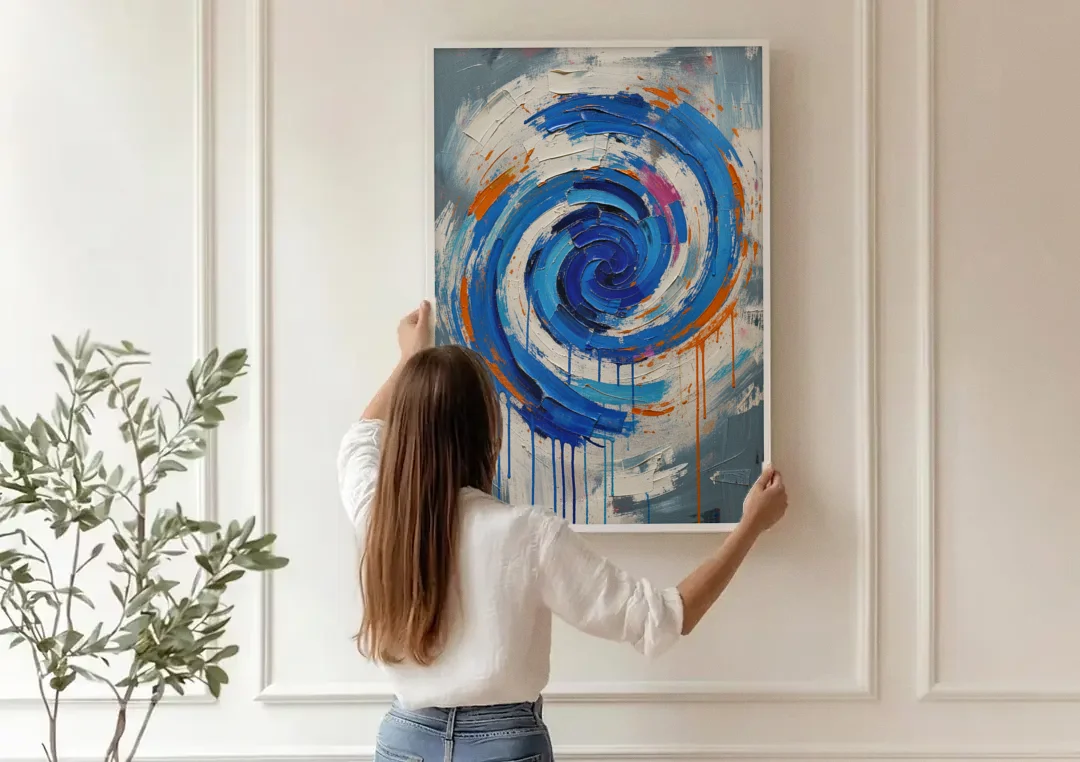 Modern Abstract Canvas Wall Art of a Cobalt Whirlpool canvas wall art being hung on a paneled wall