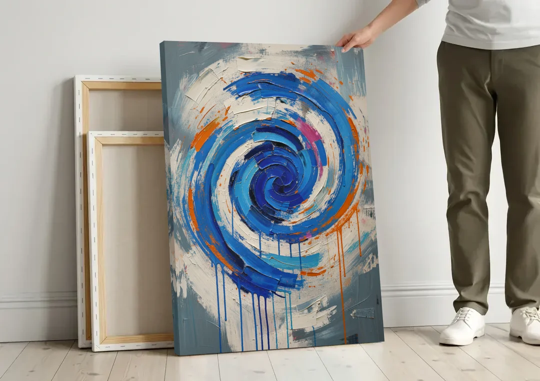 Modern Abstract Canvas Wall Art of a Cobalt Whirlpool canvas wall art leaning against a wall next to blank canvases