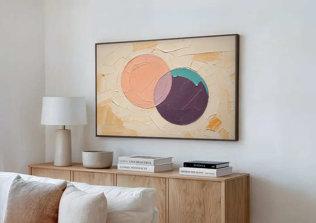 Modern Abstract Overlapping Peach and Plum Discs canvas wall art above a wooden sideboard next to a sofa