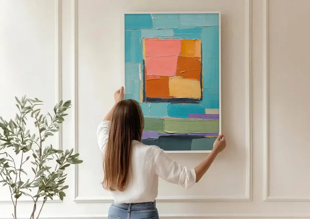 Modern Abstract Prints Sunset Square on Turquoise canvas wall art being hung on a paneled wall