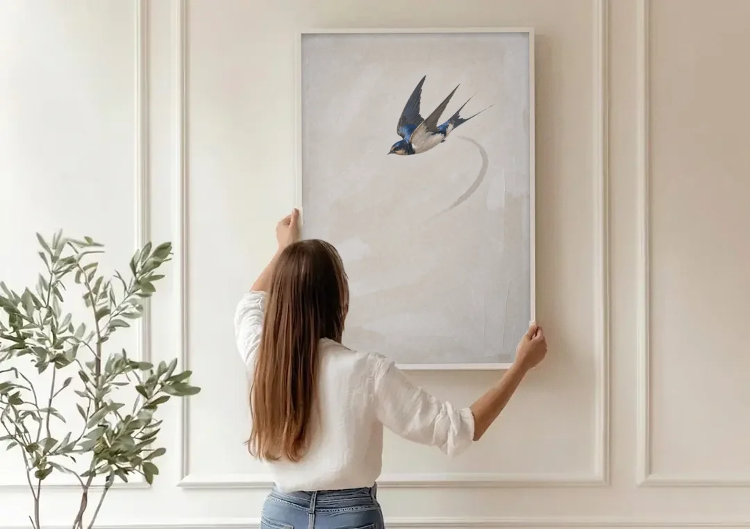 Modern Bird Painting of a Diving Barn Swallow canvas wall art being hung on a paneled wall