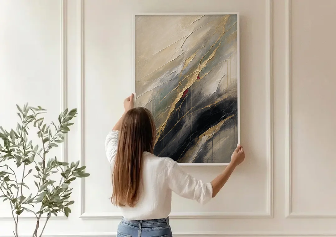 Modern Black and Gold Abstract Marble Veins canvas wall art being hung on a paneled wall