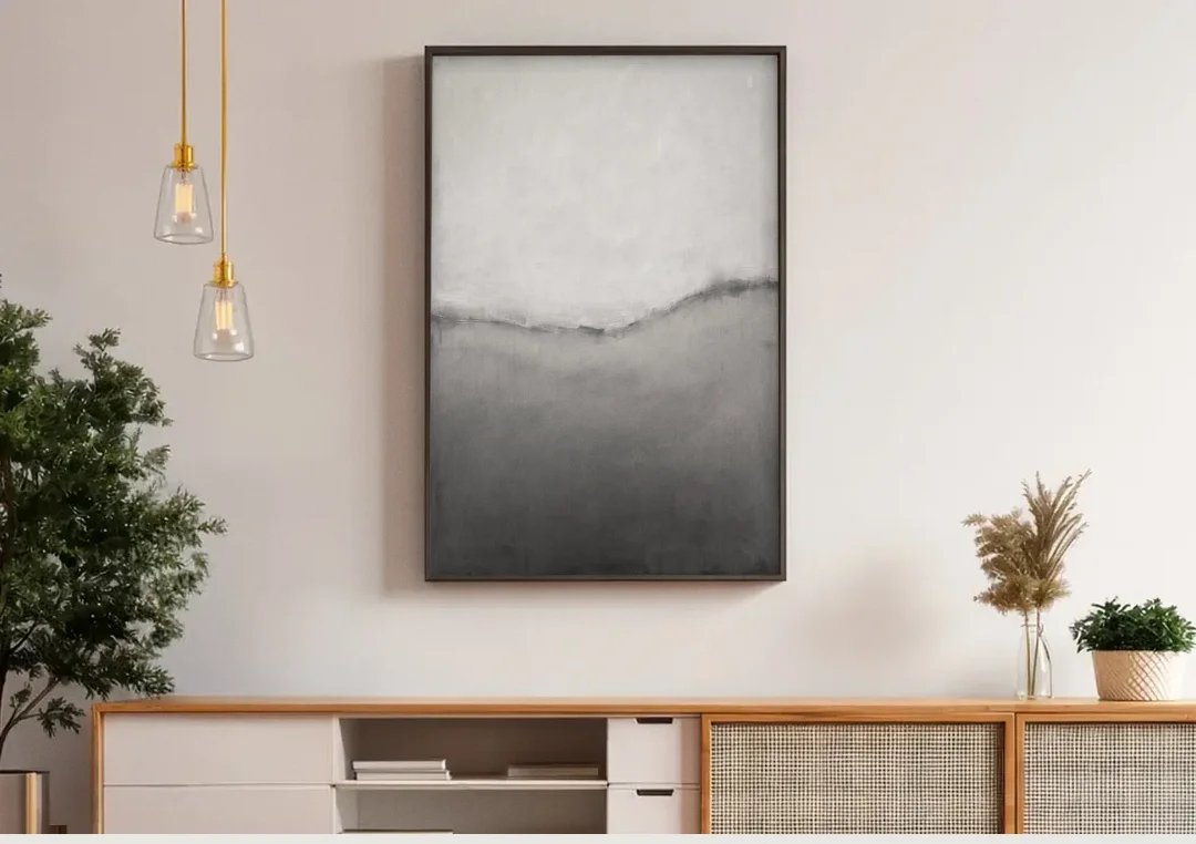 Modern Black and White Abstract Feathered Grey Seam canvas wall art above a wooden sideboard under pendant lights