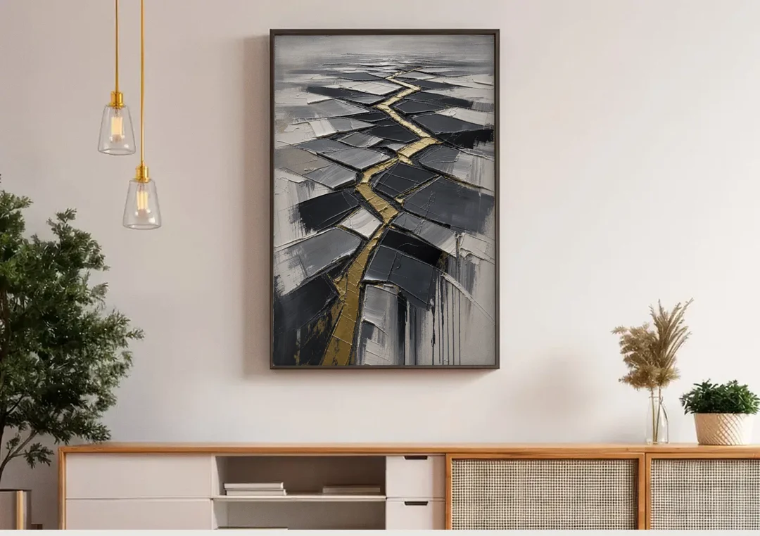 Modern Black White and Gold Abstract Fissure canvas wall art above a wooden sideboard under pendant lights