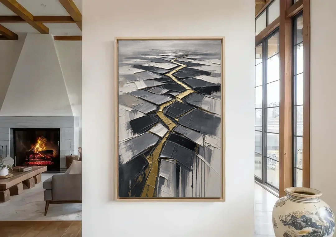 Modern Black White and Gold Abstract Fissure canvas wall art in a living room with a fireplace