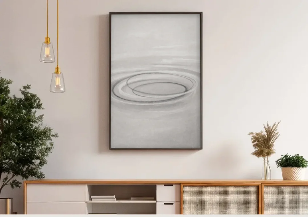 Modern Black White and Grey Abstract Ripple Rings canvas wall art above a wooden sideboard under pendant lights