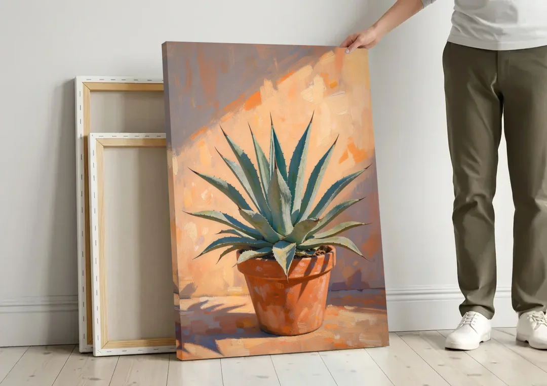 Modern Blue Agave Plant in Afternoon Sun canvas wall art leaning against a wall next to blank canvases