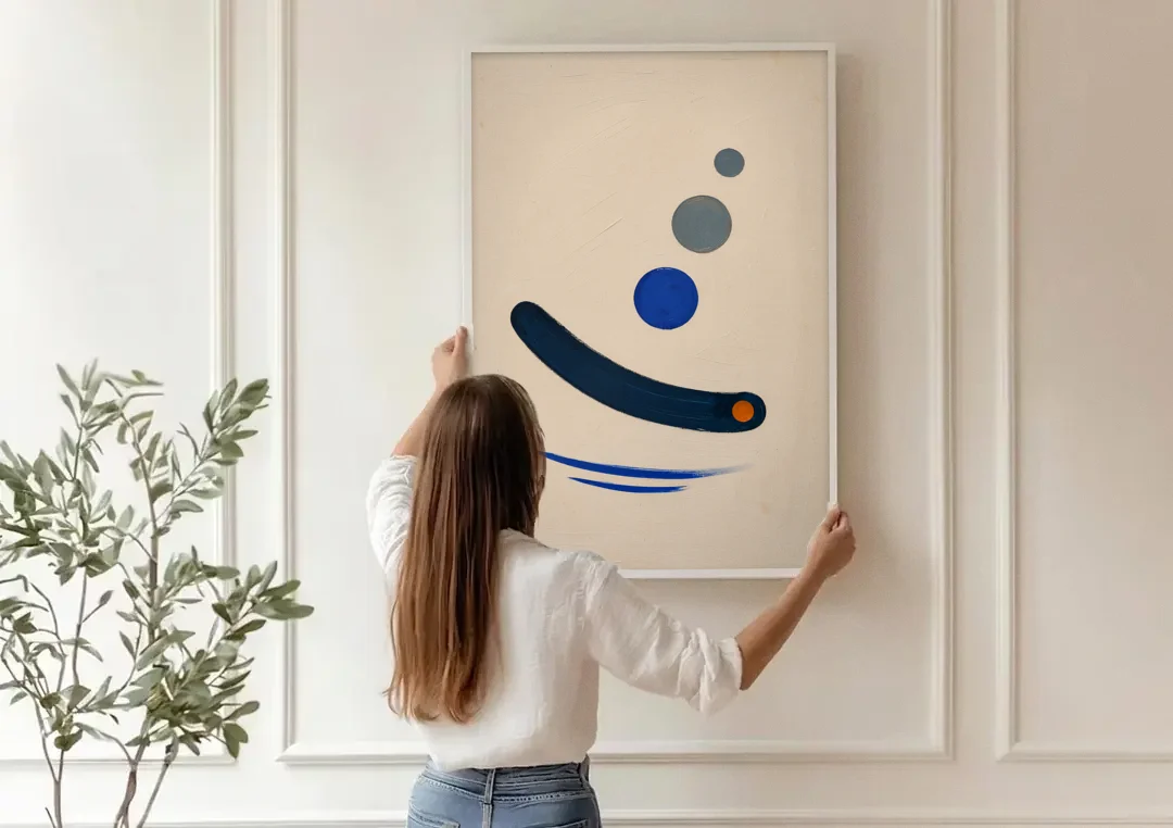 Modern Blue Wall Art with a Navy Boomerang canvas wall art being hung on a paneled wall