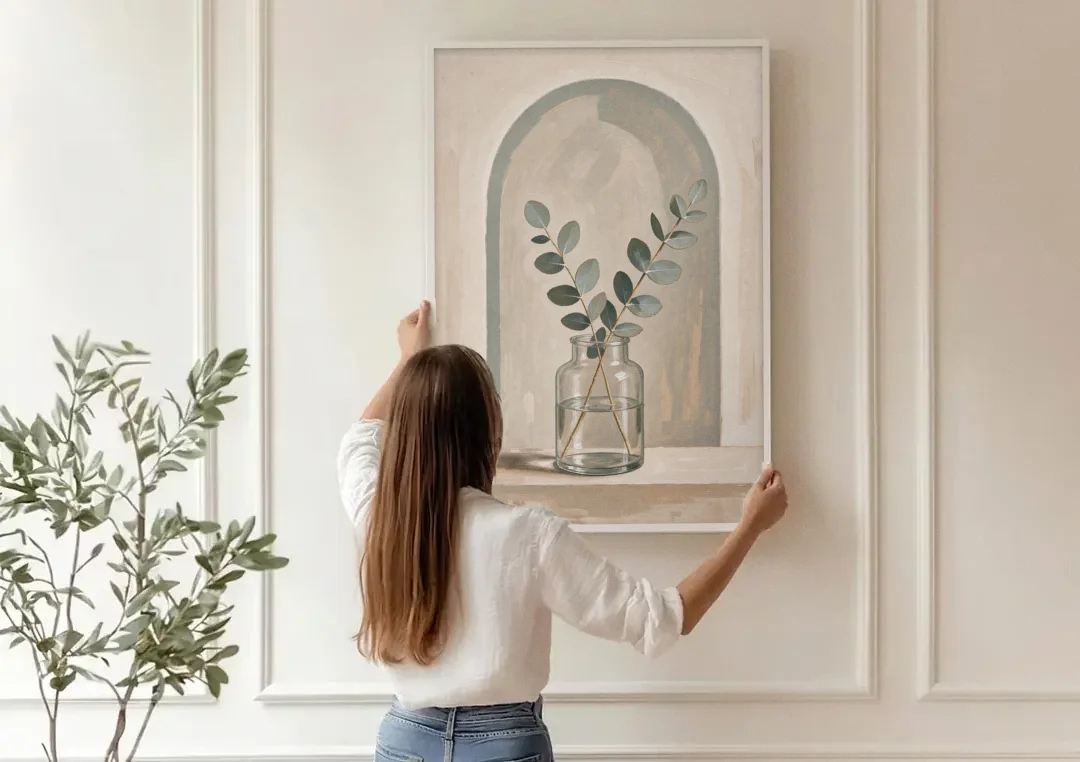 Modern Botanical Prints Eucalyptus Sprig Under an Arch canvas wall art being hung on a paneled wall