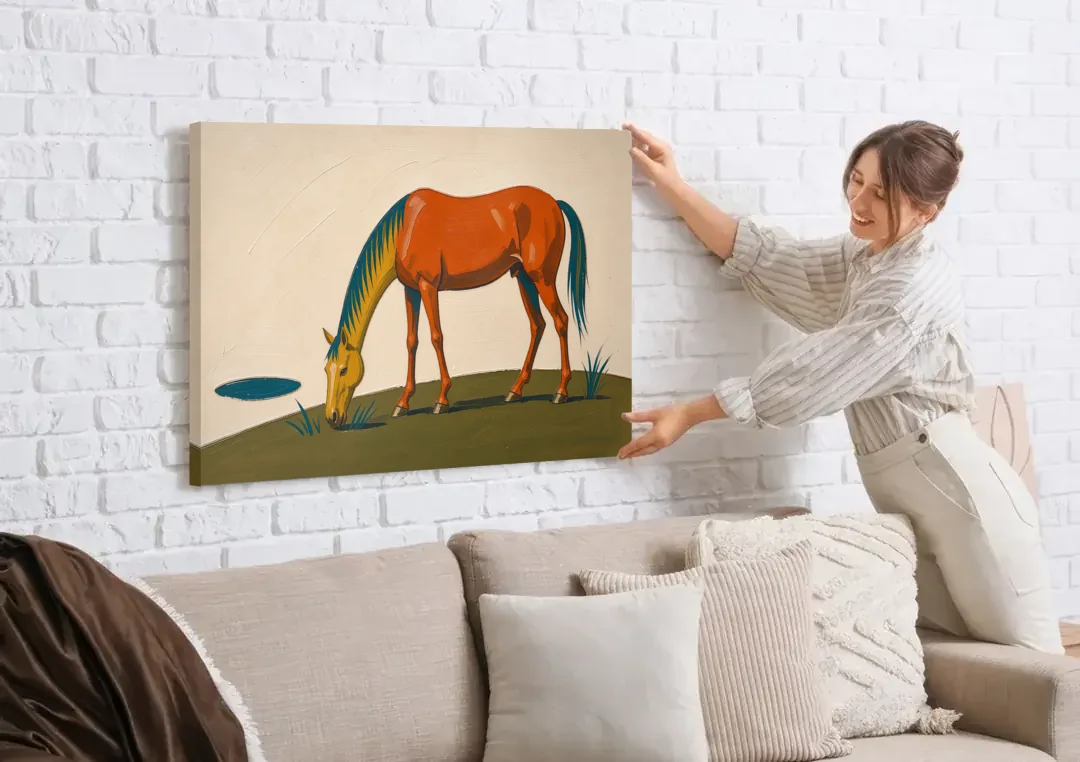 Modern Horse Wall Art of a Grazing Chestnut canvas wall art being hung on a white brick wall above a sofa