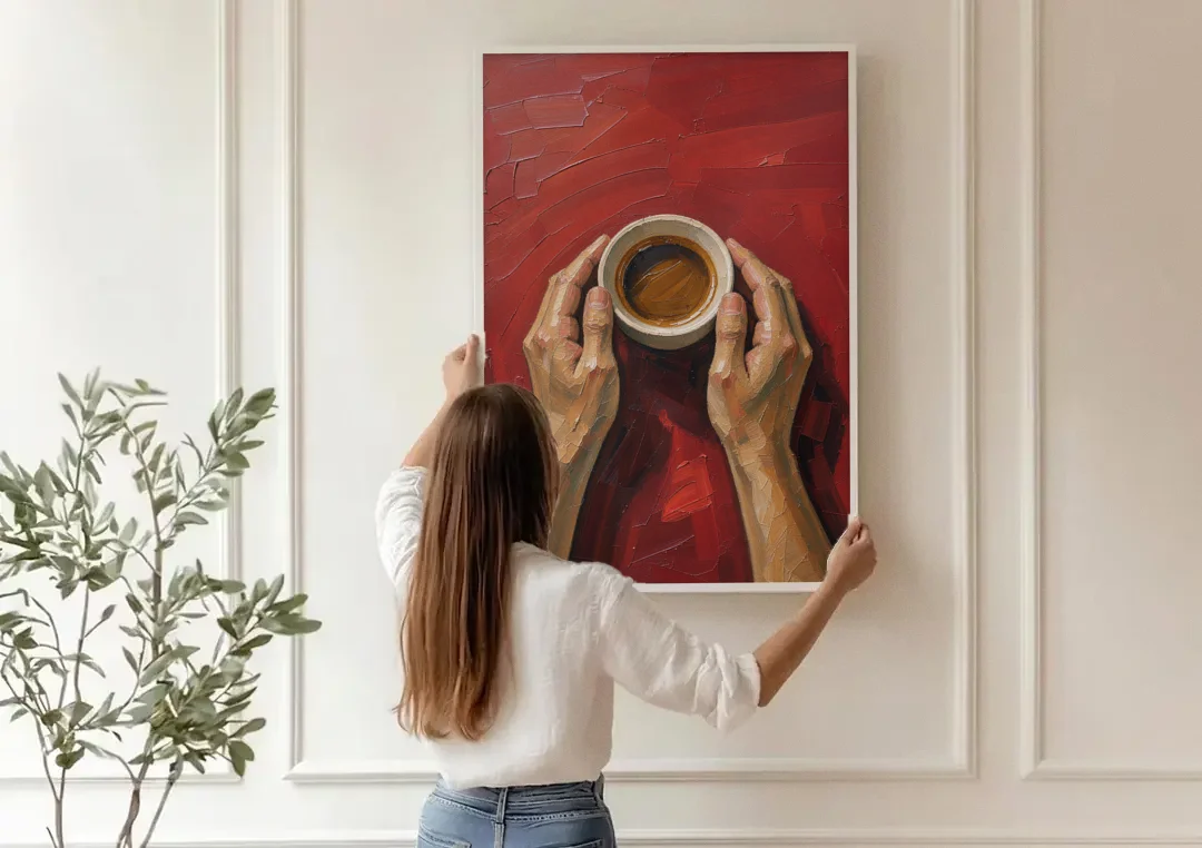 Modern Kitchen Wall Art of Hands Cradling Coffee canvas wall art being hung on a paneled wall