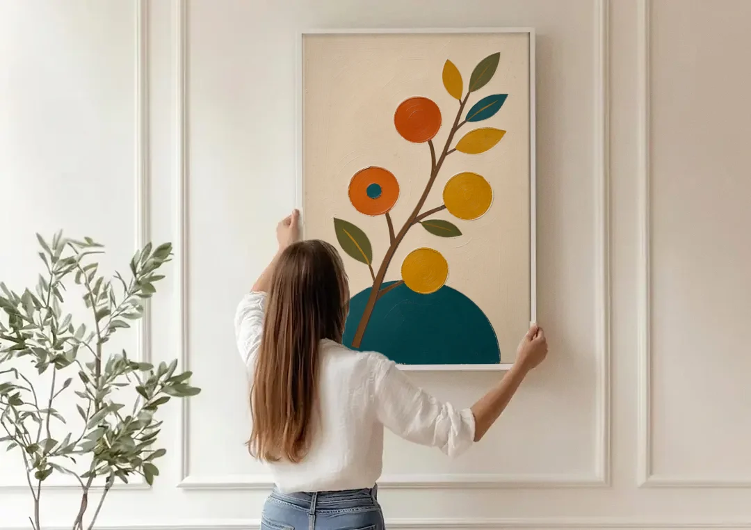 Modern Living Room Wall Art with Blossoming Branch canvas wall art being hung on a paneled wall