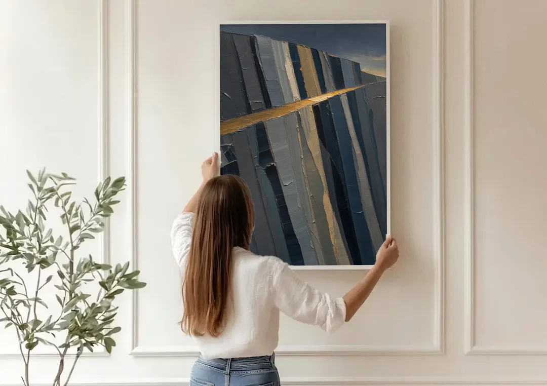 Modern Masculine Charcoal Gray Cliff with Ochre Ledge canvas wall art being hung on a paneled wall