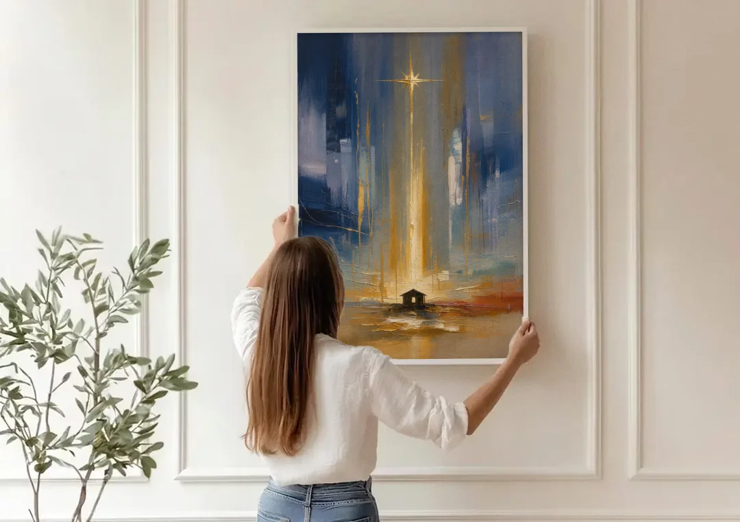 Modern Nativity Painting with Falling Gold Light canvas wall art being hung on a paneled wall