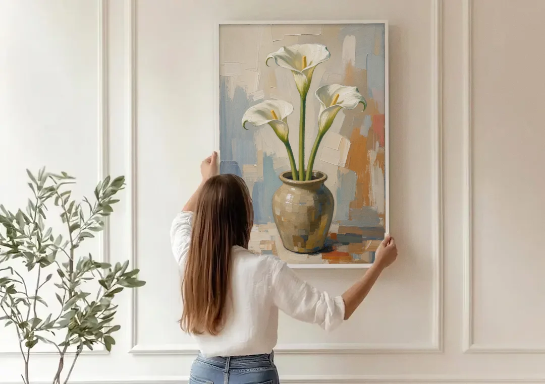 Modern Neutral Floral Calla Lilies in Stoneware canvas wall art being hung on a paneled wall