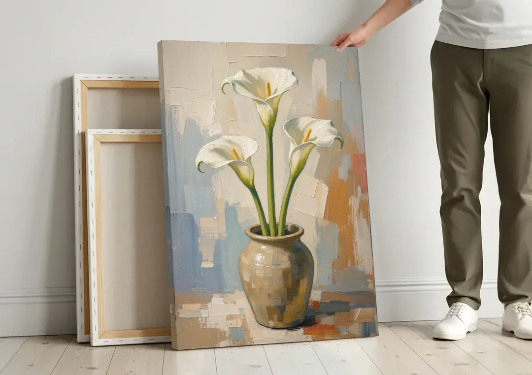 Modern Neutral Floral Calla Lilies in Stoneware canvas wall art leaning against a wall next to blank canvases