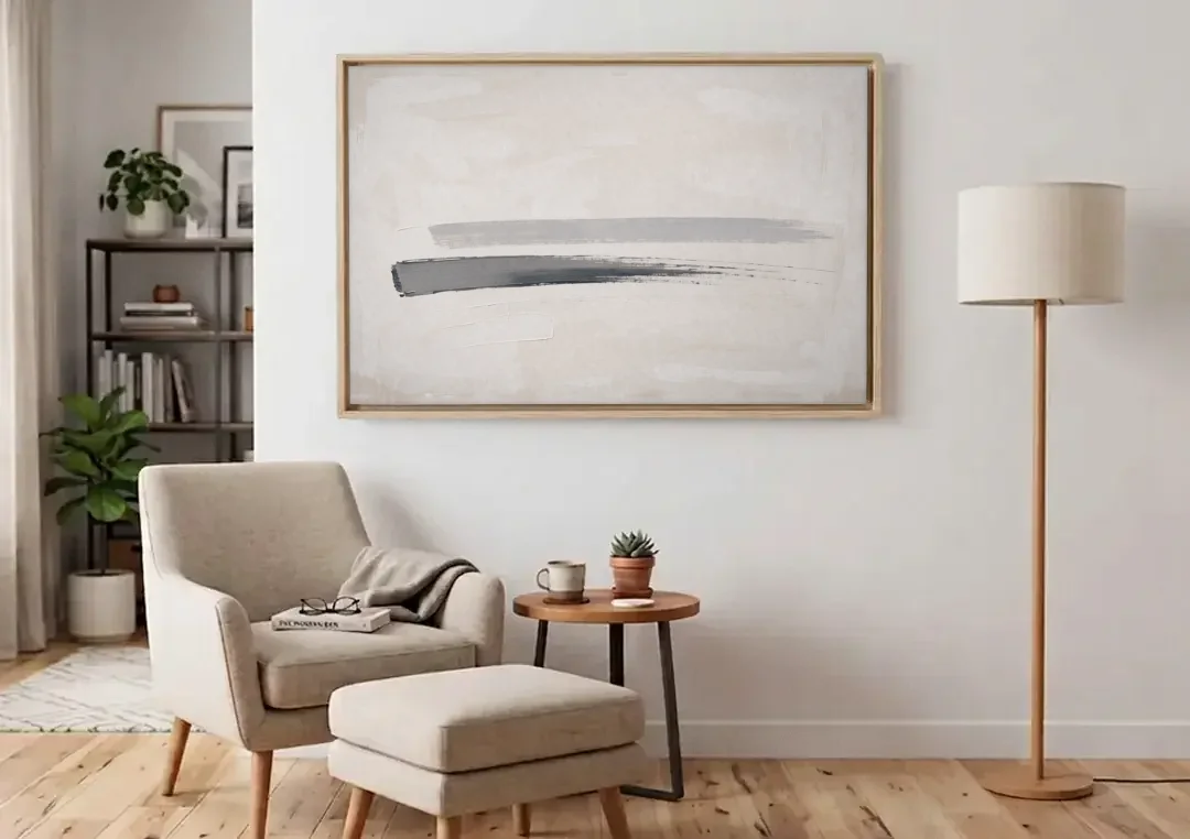 Modern Office Wall Decor with One Graphite Stroke canvas wall art above an armchair in a bright living room