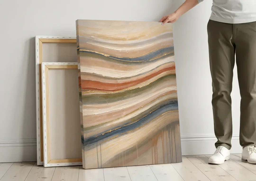 Modern Sandstone Strata with Gold Seams for the Bathroom canvas wall art leaning against a wall next to blank canvases