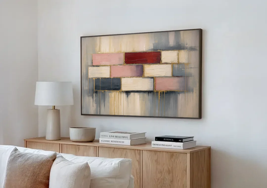 Modern Textured Wall Art of Blush and Crimson Stones canvas wall art above a wooden sideboard next to a sofa
