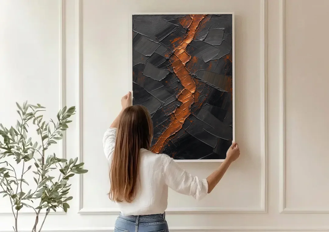 Molten Copper Fissure in Black and Copper canvas wall art being hung on a paneled wall
