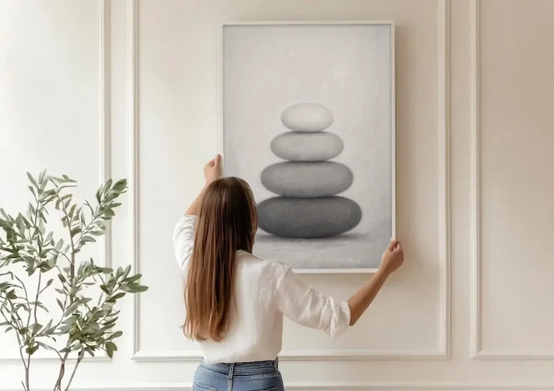 Monochrome Abstract Painting of Stacked Ovals canvas wall art being hung on a paneled wall