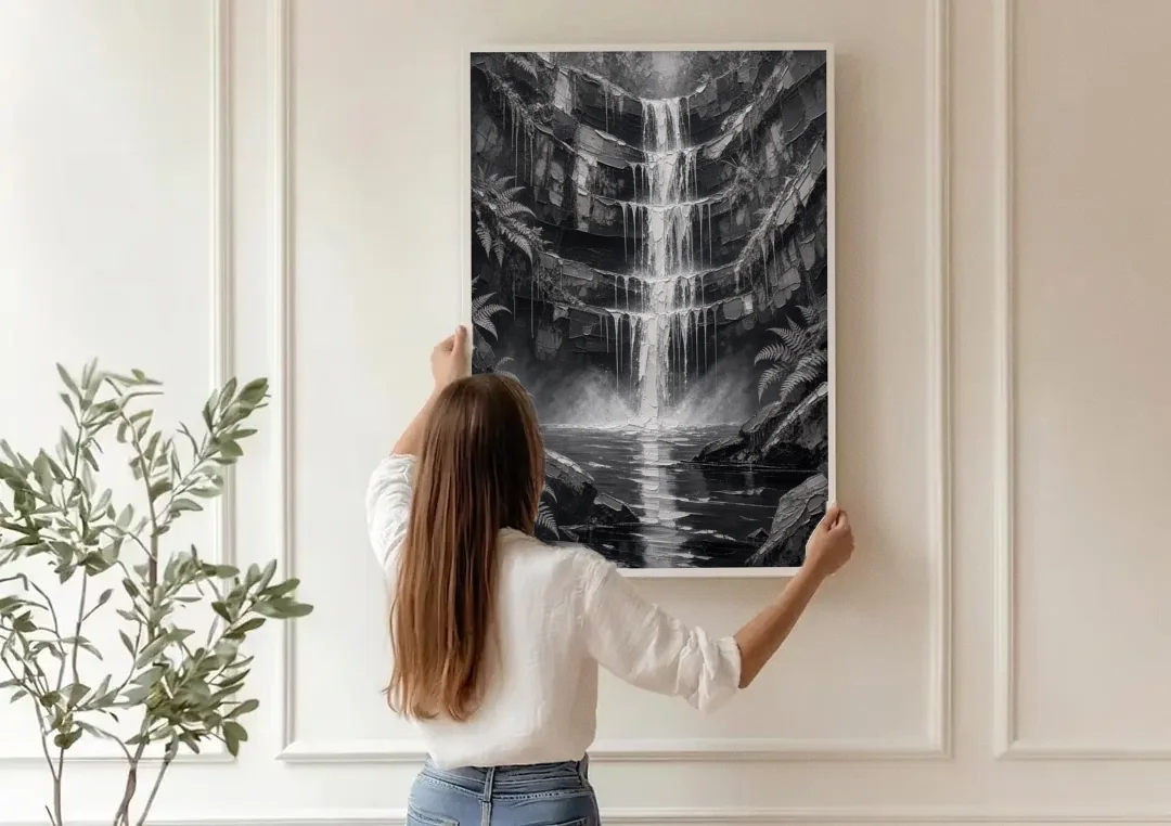 Monochrome Landscape Painting of a Tiered Waterfall canvas wall art being hung on a paneled wall