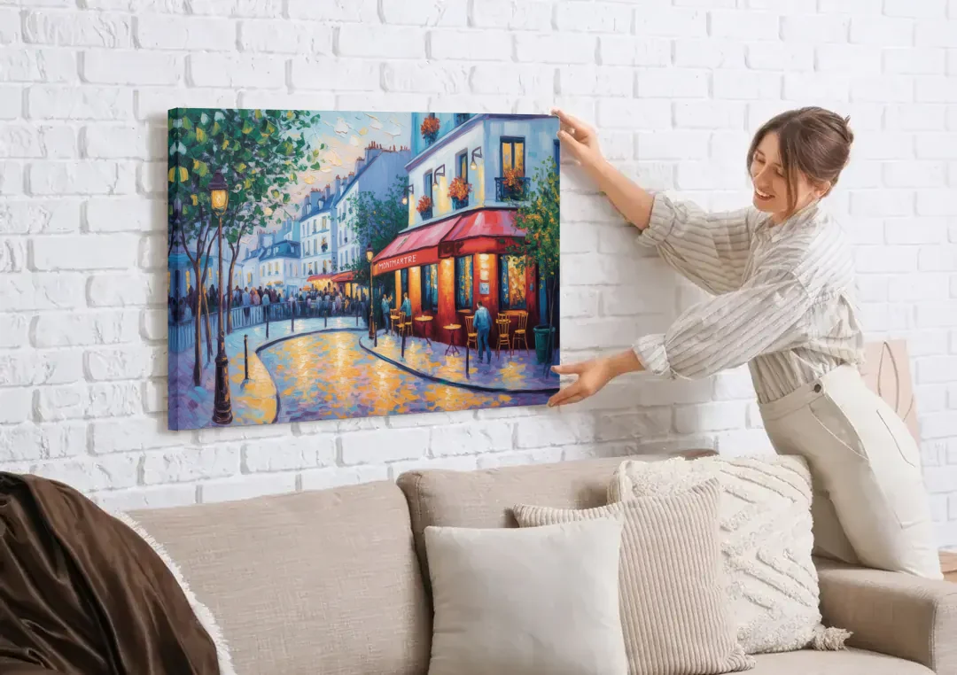 Montmartre Moments canvas wall art being hung on a white brick wall above a sofa