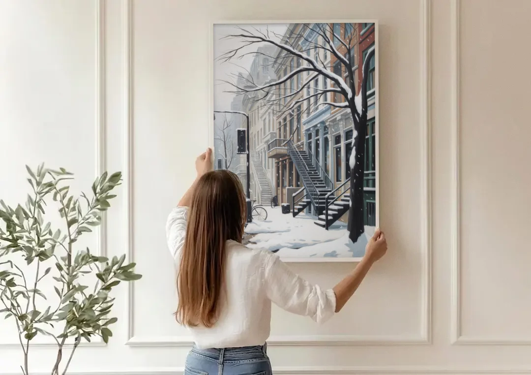 Montreal Snowy Streets canvas wall art being hung on a paneled wall