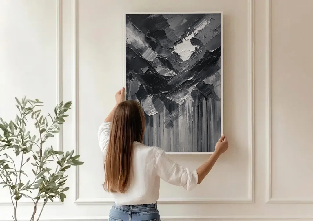 Moody Abstract Storm Tear in Charcoal Impasto canvas wall art being hung on a paneled wall