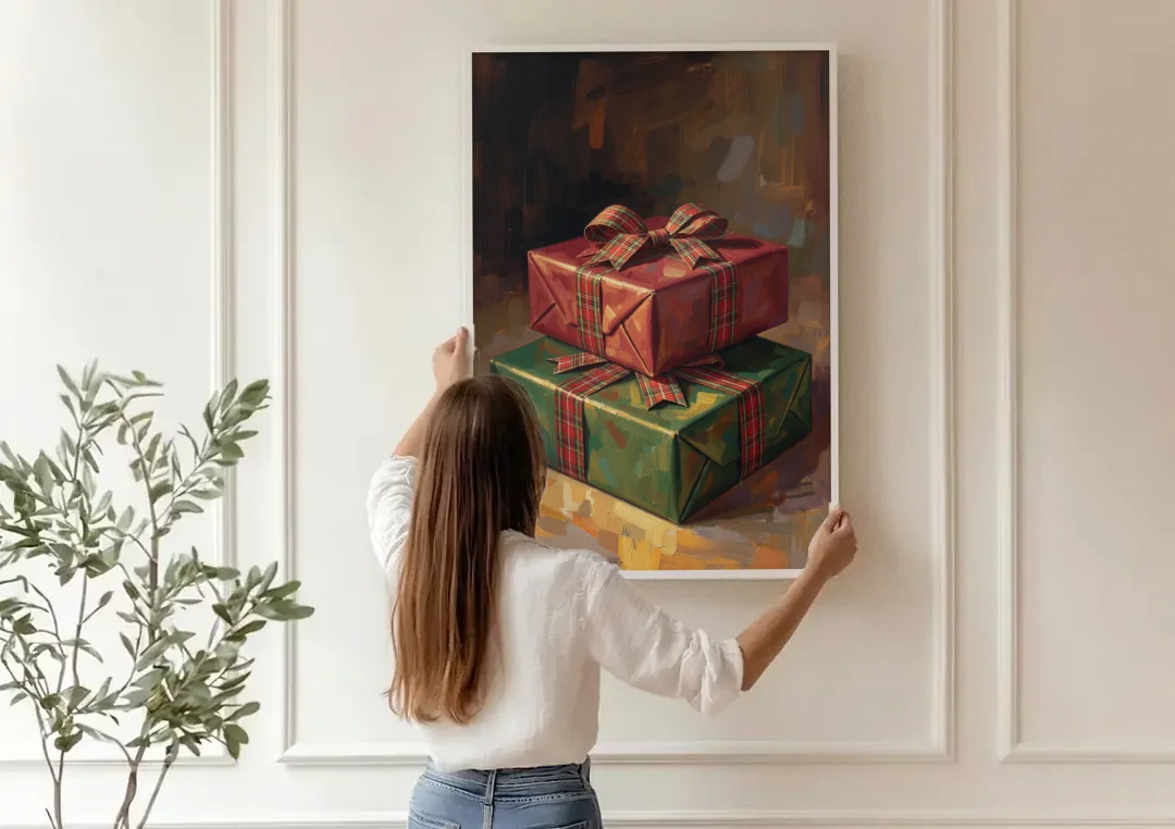 Moody Christmas Wall Art of Two Stacked Plaid Gifts canvas wall art being hung on a paneled wall